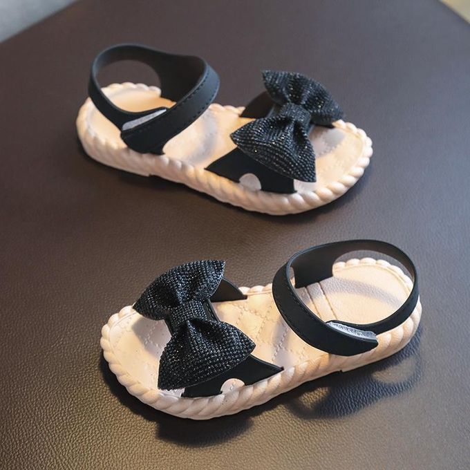 black glitter bow ankle-strap sandals